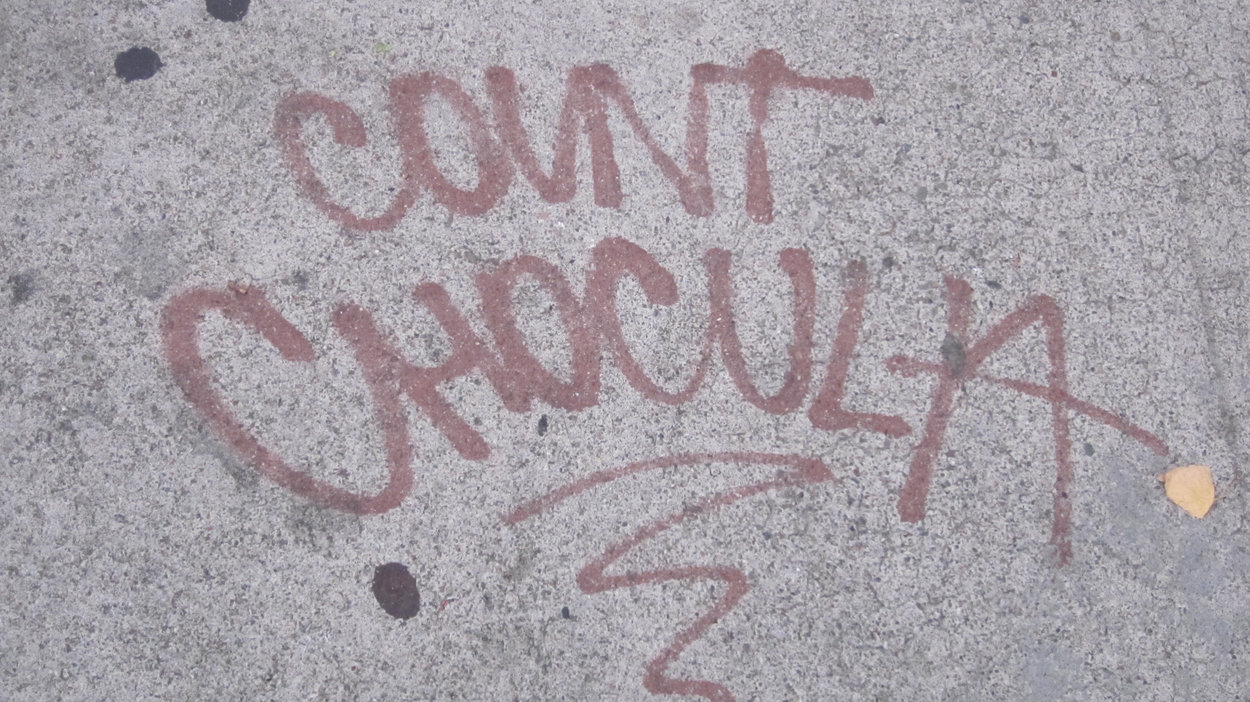 Graffiti tags on a storefront wall in San Francisco
